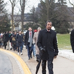 people marching on campus